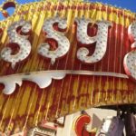 The ketchup and mustard colors of the Sassy Sally's sign.