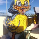 The sign from Ugly Duckling Car Sales welcomes all visitors to the Neon Museum