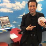 Rod Chow entertains visitors with amazing card tricks.