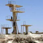 Boys on the diving boards of the old Soviet pool near Kabul, Afghanistan